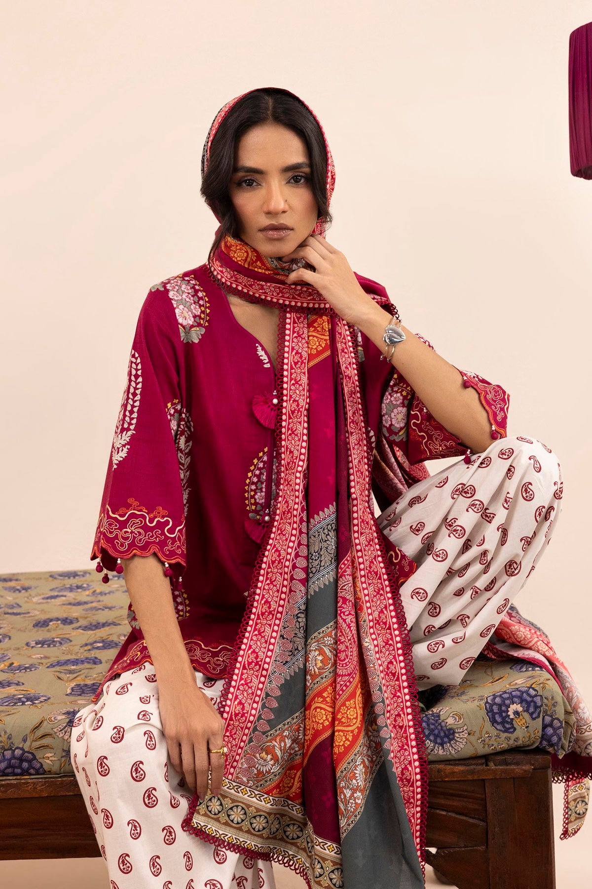 Women's printed three piece suit with burgundy tunic, patterned dupatta and paisley trousers