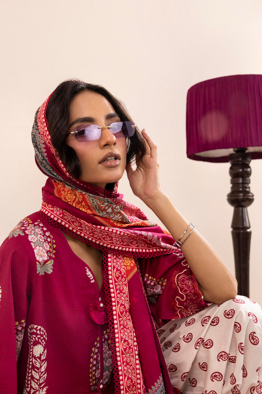 Women's printed three piece suit with burgundy tunic, patterned dupatta and paisley trousers
