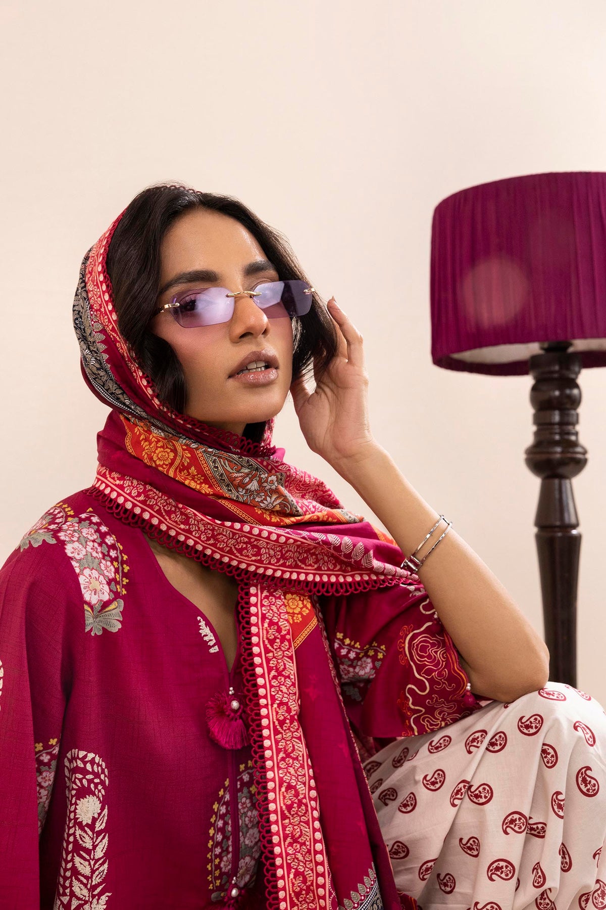 Women's printed three piece suit with burgundy tunic, patterned dupatta and paisley trousers
