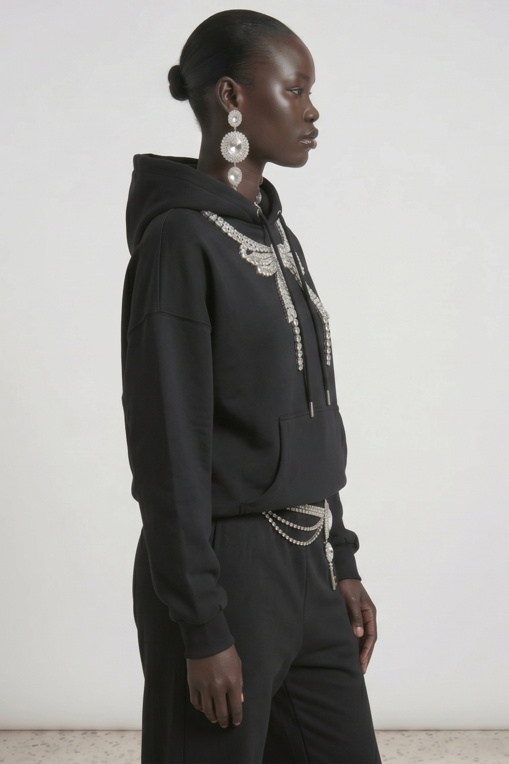 Black hoodie with embellished wing graphic, drawstring hood and kangaroo pocket
