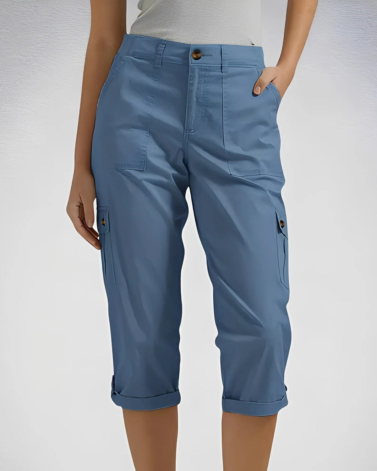 Women's cropped cargo trousers with rolled cuffs and multiple utility pockets
