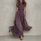 Women's purple chiffon maxi dress with high neckline, short puff sleeves and flowing full-length skirt