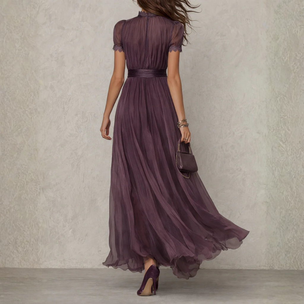 Women's purple chiffon maxi dress with high neckline, short puff sleeves and flowing full-length skirt