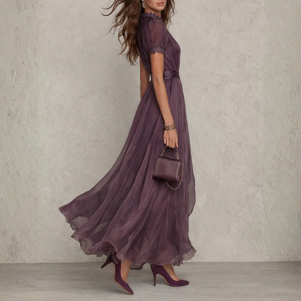Women's purple chiffon maxi dress with high neckline, short puff sleeves and flowing full-length skirt
