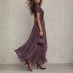 Women's purple chiffon maxi dress with high neckline, short puff sleeves and flowing full-length skirt