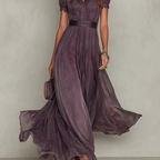 Women's purple chiffon maxi dress with high neckline, short puff sleeves and flowing full-length skirt