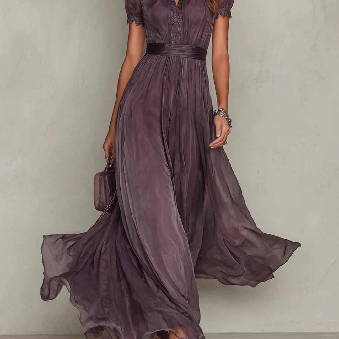 Women's purple chiffon maxi dress with high neckline, short puff sleeves and flowing full-length skirt