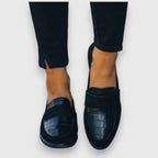 Women's black croc-effect slip-on loafers with rounded toes and low soles