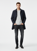 Men's button-front trench coat with spread collar and side pockets