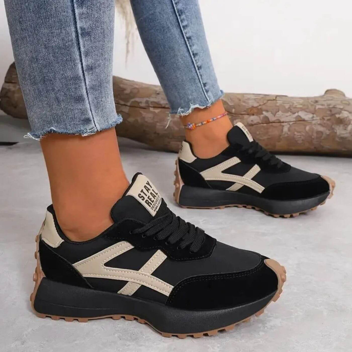 Women's lace-up trainers with rounded toes, contrast side panels and raised textured soles
