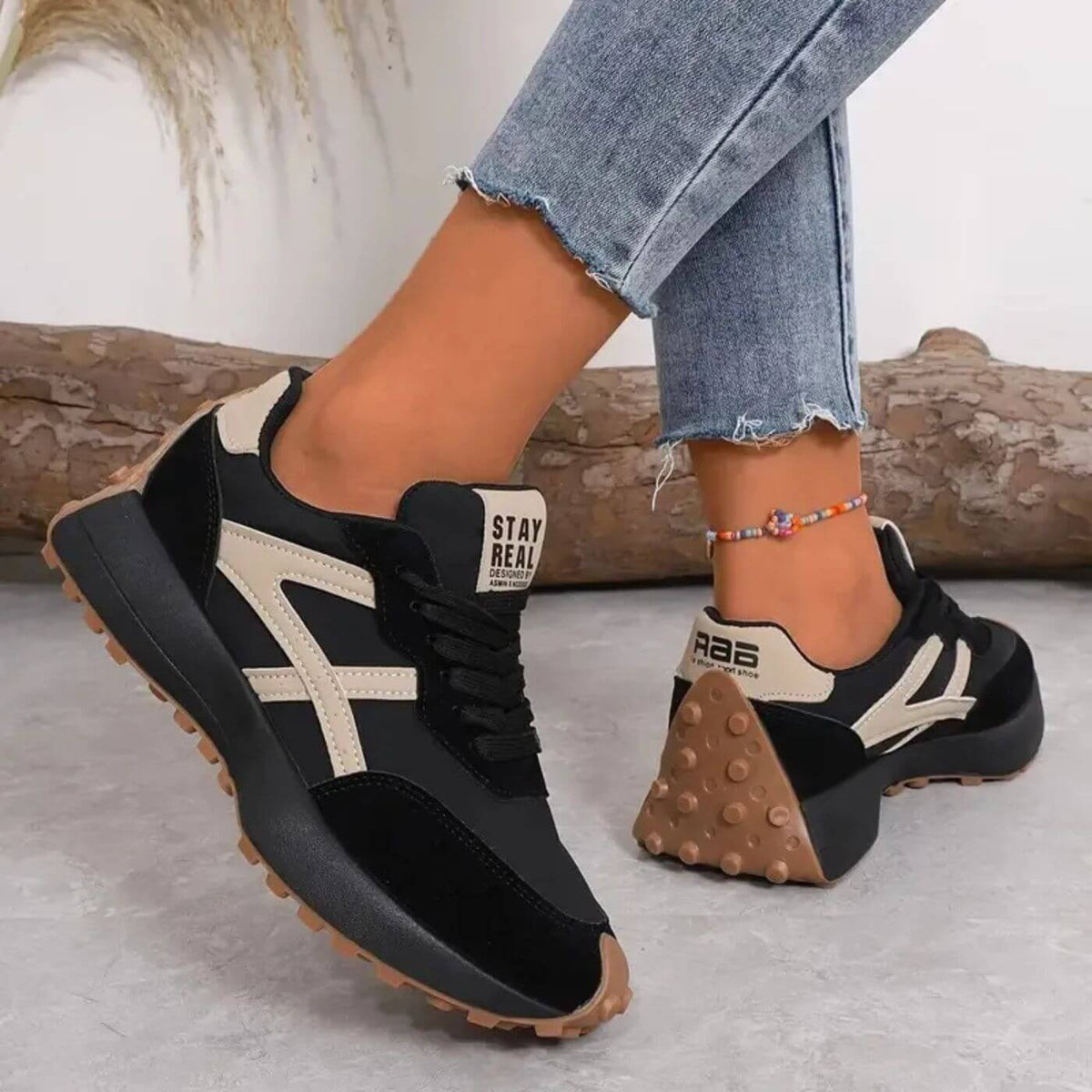 Women's lace-up trainers with rounded toes, contrast side panels and raised textured soles