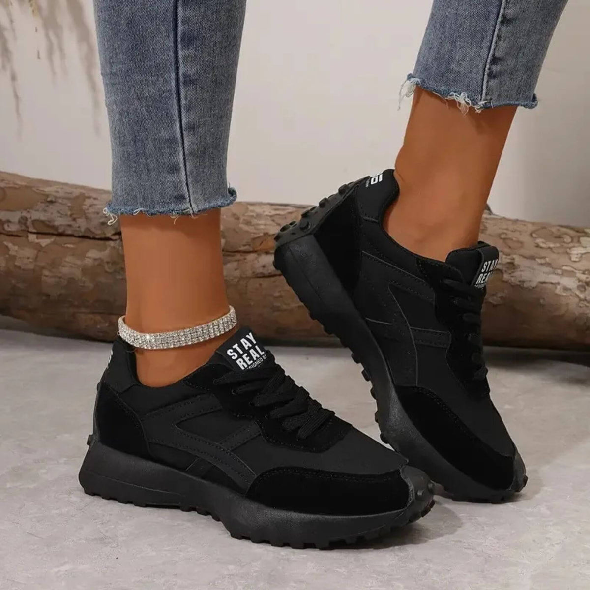 Women's lace-up trainers with rounded toes, contrast side panels and raised textured soles