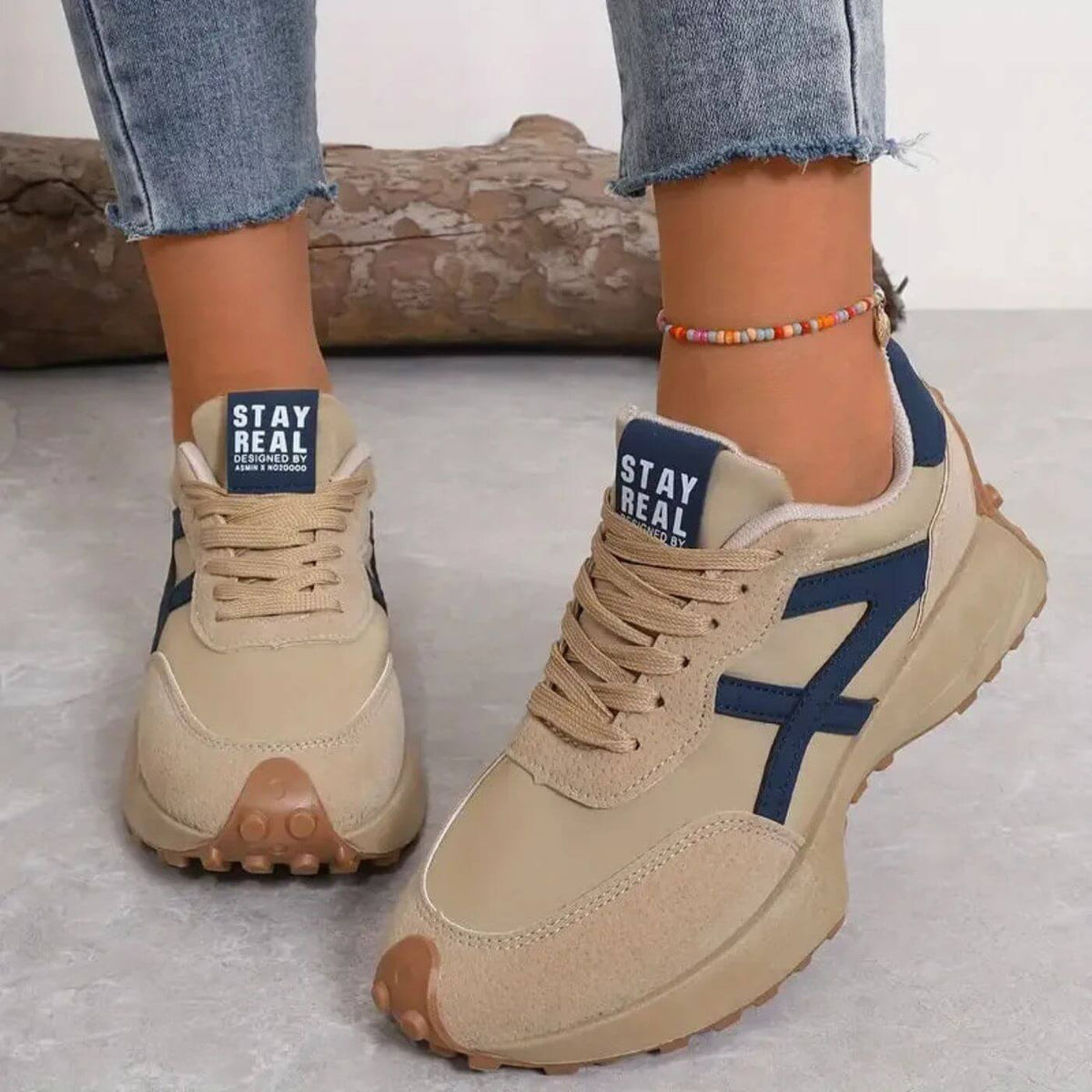 Women's lace-up trainers with rounded toes, contrast side panels and raised textured soles