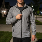 Men's grey reflective full-zip jacket with stand collar and zipped pockets