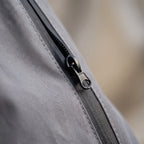 Men's grey reflective full-zip jacket with stand collar and zipped pockets