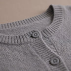 Women's grey fine knit cardigan with round neck and button front