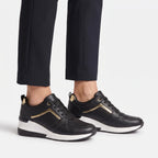 Women's lace-up wedge trainers with perforated panels and raised soles