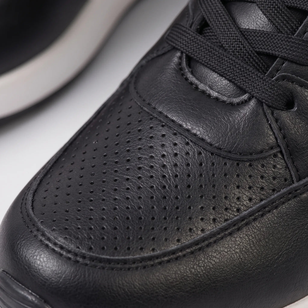 Women's lace-up wedge trainers with perforated panels and raised soles