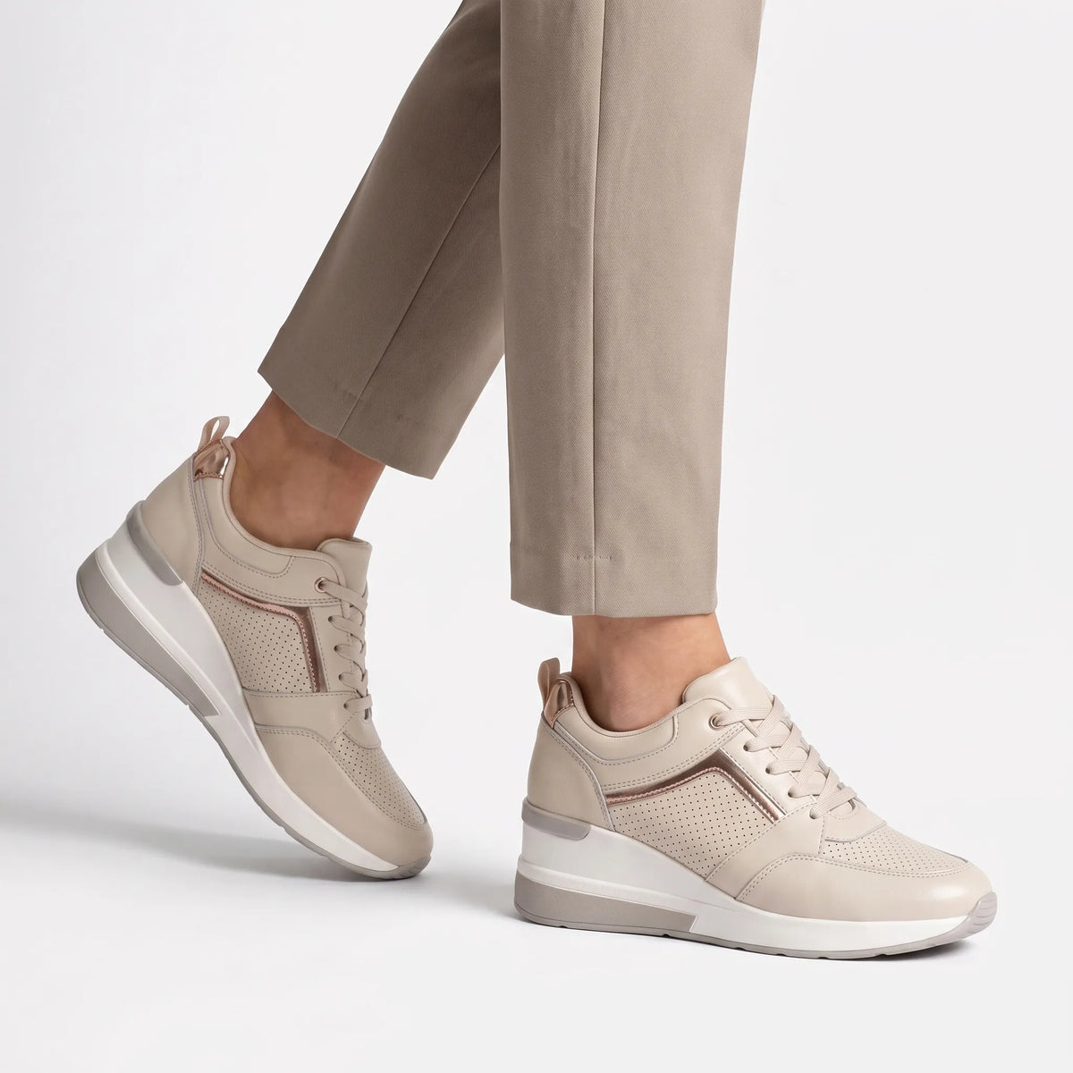 Women's lace-up wedge trainers with perforated panels and raised soles