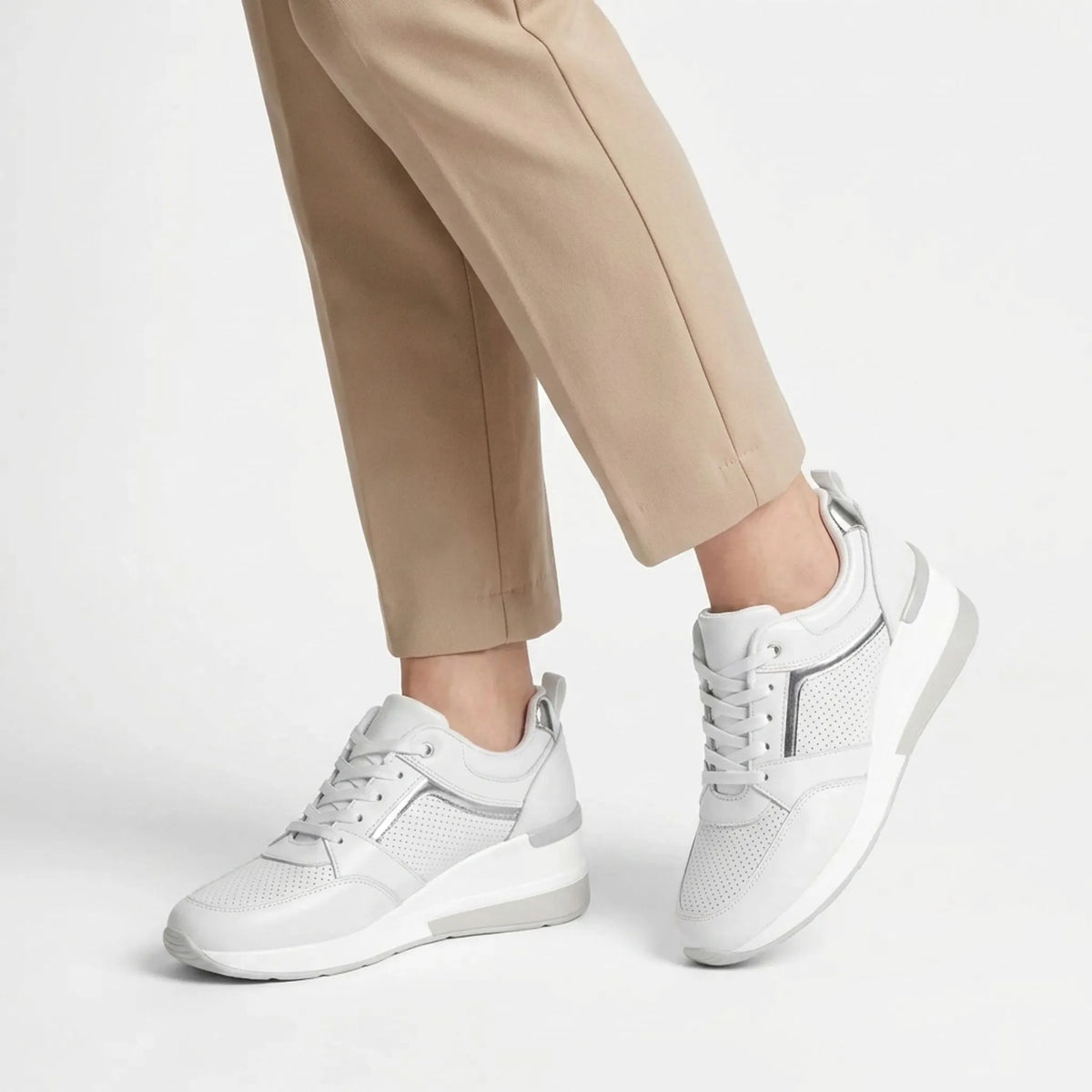 Women's lace-up wedge trainers with perforated panels and raised soles
