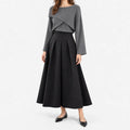 Women's two-piece outfit with crossover knit top and flared midi skirt