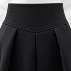 Women's two-piece outfit with crossover knit top and flared midi skirt