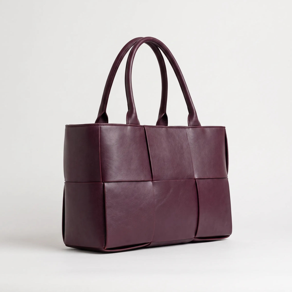 Structured panel tote bag with double handles and open top