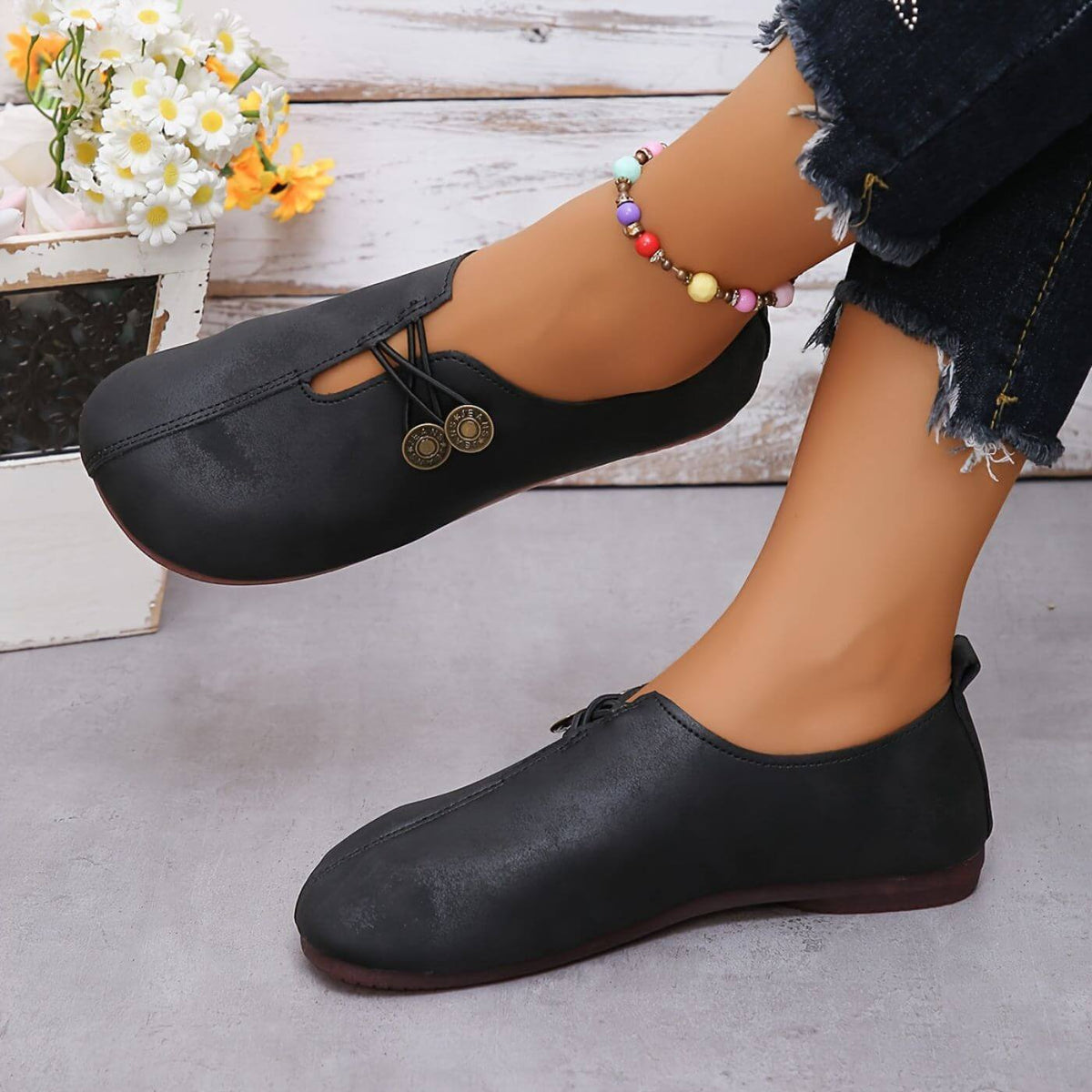 Women's flat slip-on shoes with elastic lace detail and round buttons