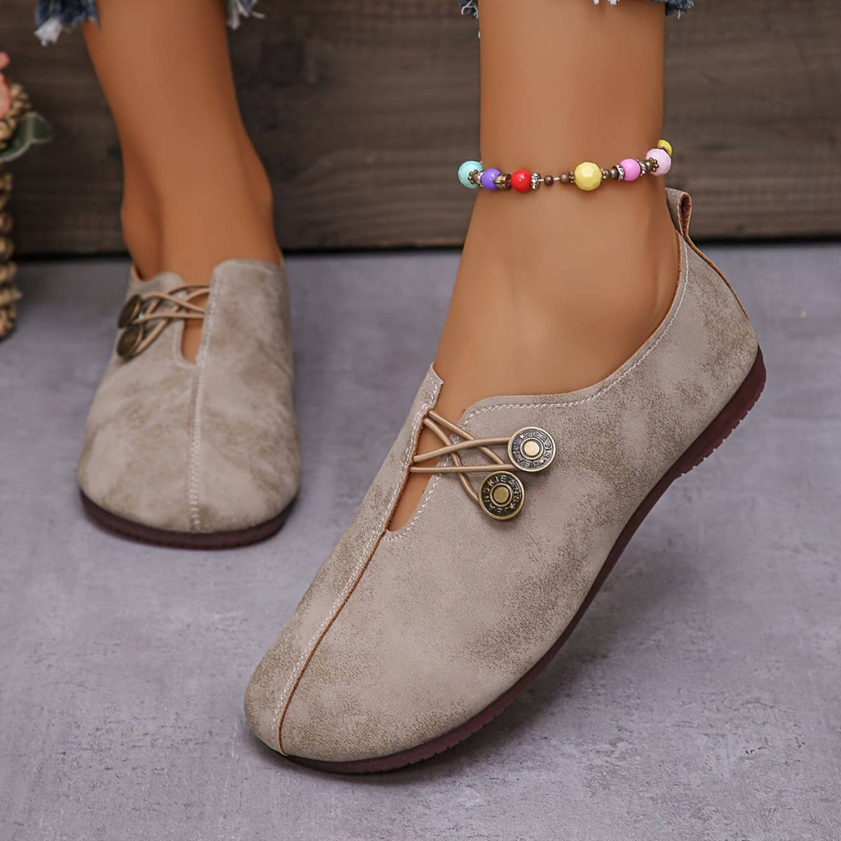 Women's flat slip-on shoes with elastic lace detail and round buttons