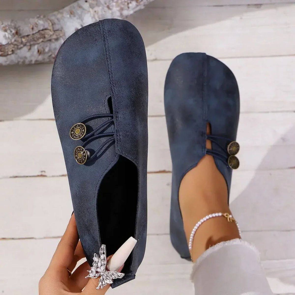 Women's flat slip-on shoes with elastic lace detail and round buttons