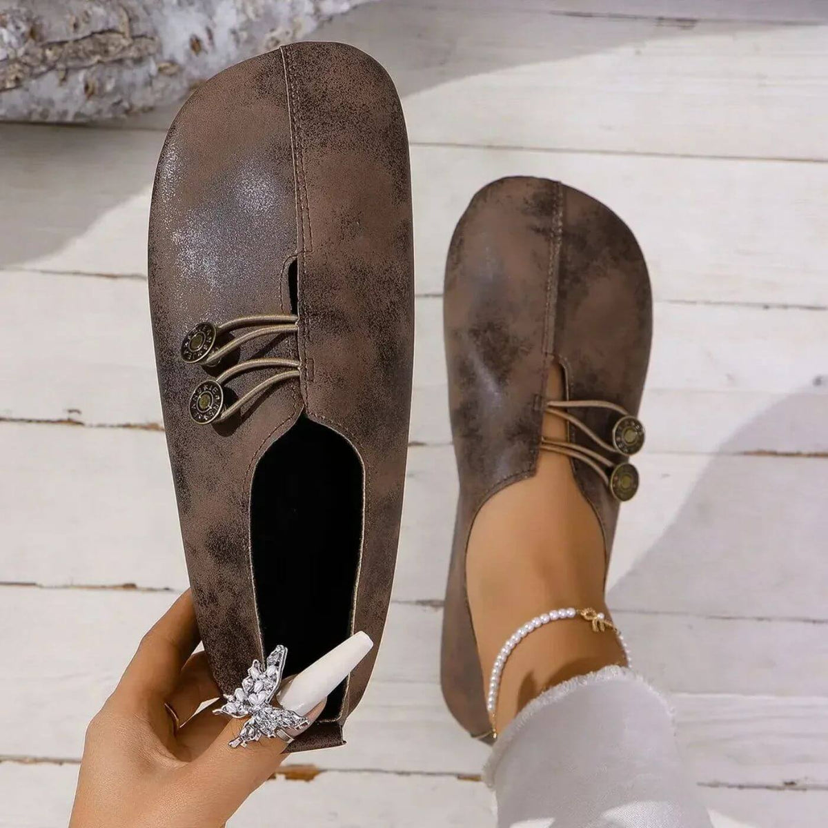 Women's flat slip-on shoes with elastic lace detail and round buttons