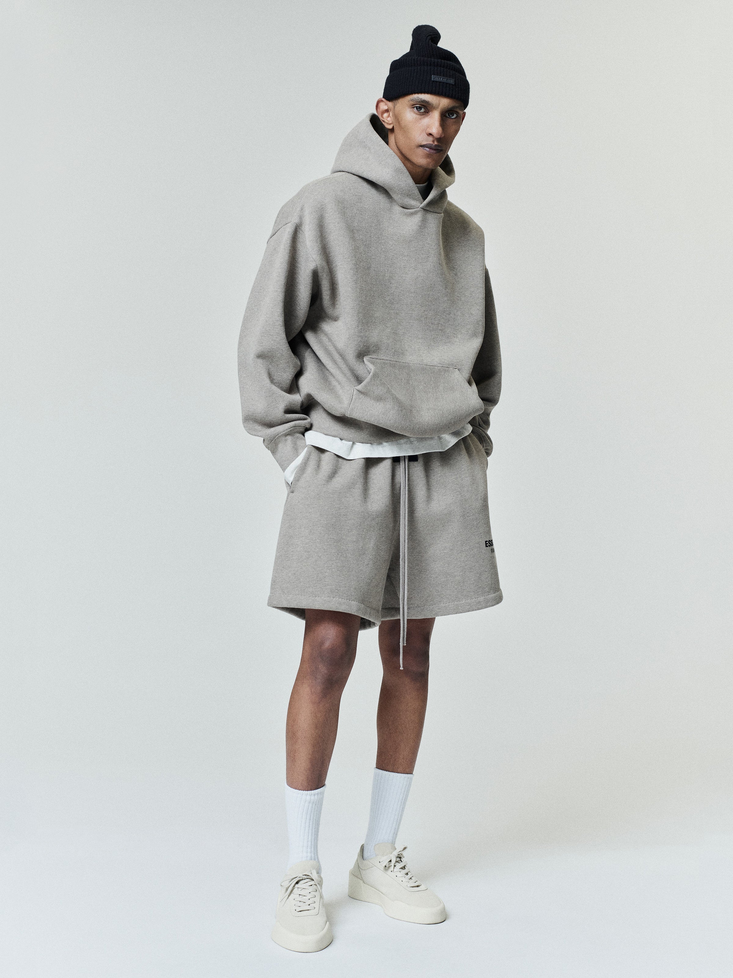 Brown men's pullover hoodie with hood, kangaroo pocket and back Essentials Fear of God text