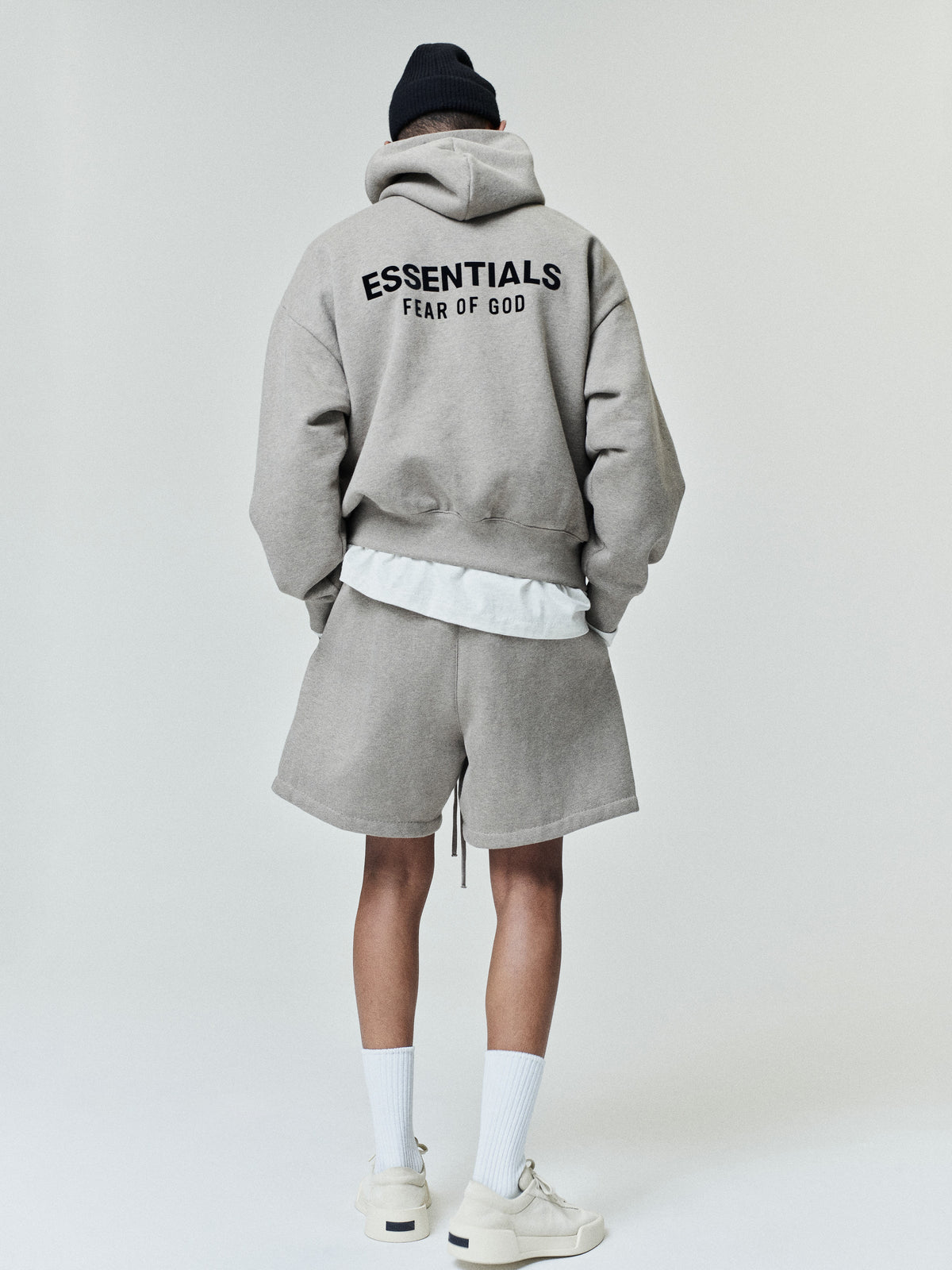 Brown men's pullover hoodie with hood, kangaroo pocket and back Essentials Fear of God text