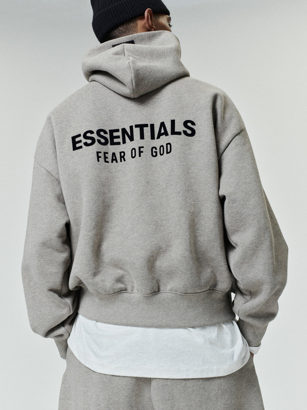 Brown men's pullover hoodie with hood, kangaroo pocket and back Essentials Fear of God text