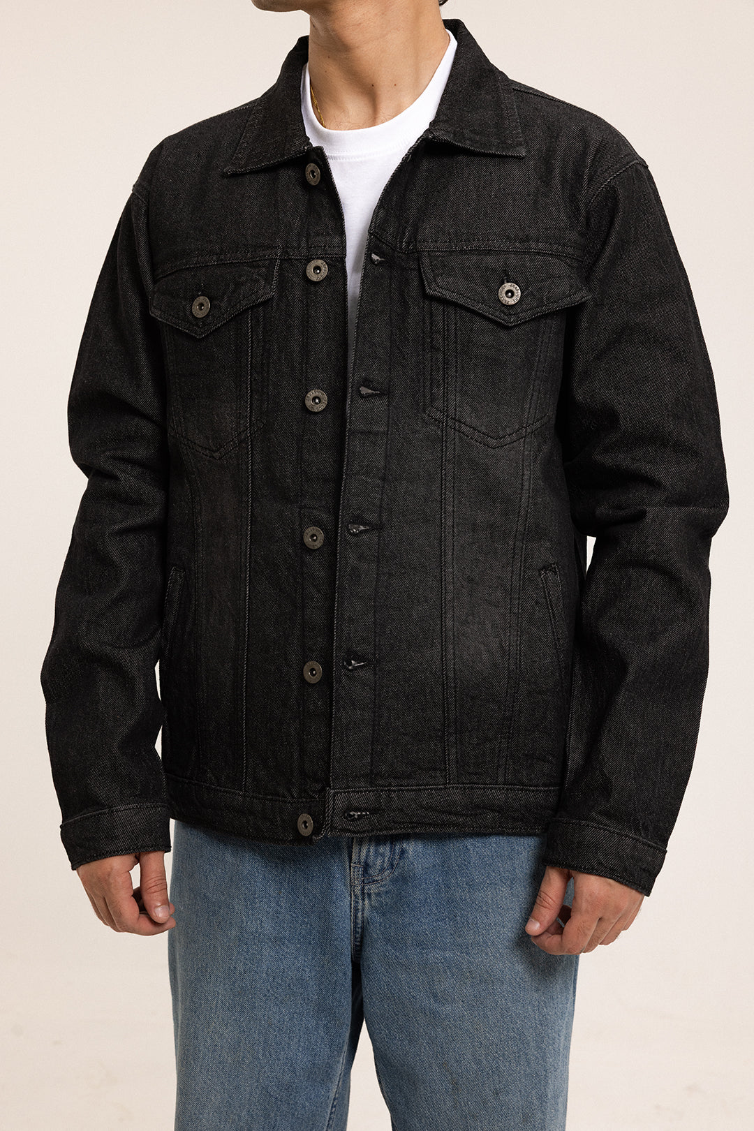 Men's black button front jacket with pointed collar and flap chest pockets