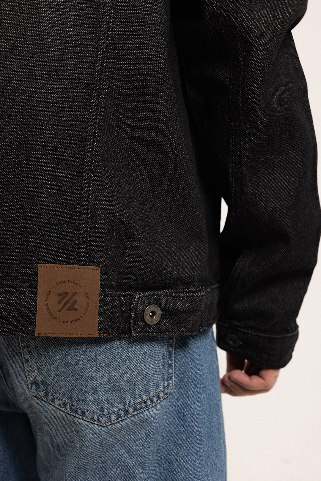 Men's black button front jacket with pointed collar and flap chest pockets