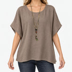 Women's relaxed short-sleeve top with round neckline and curved hem