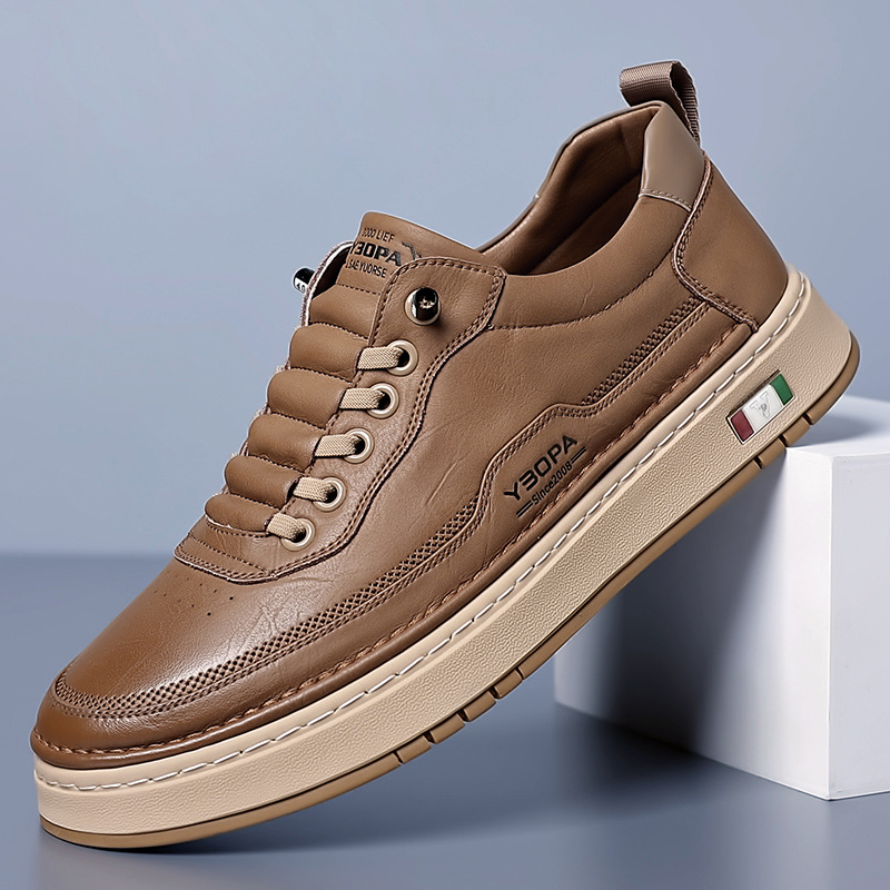 Low-top lace-up trainer with panelled upper, round toe and flat textured sole