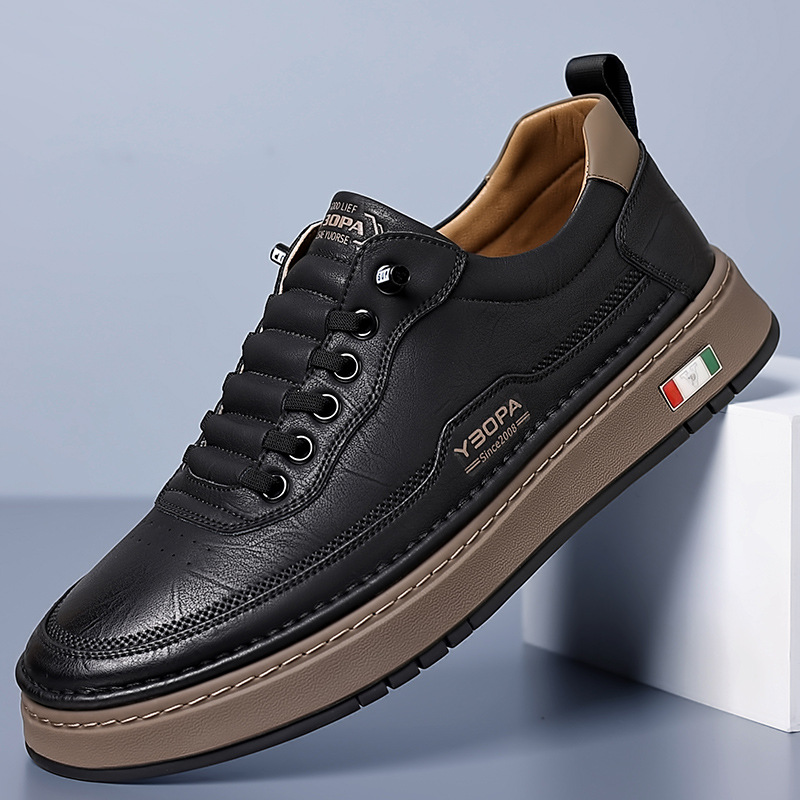 Low-top lace-up trainer with panelled upper, round toe and flat textured sole