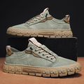 Low-top lace-up sneakers with panelled uppers and thick textured soles