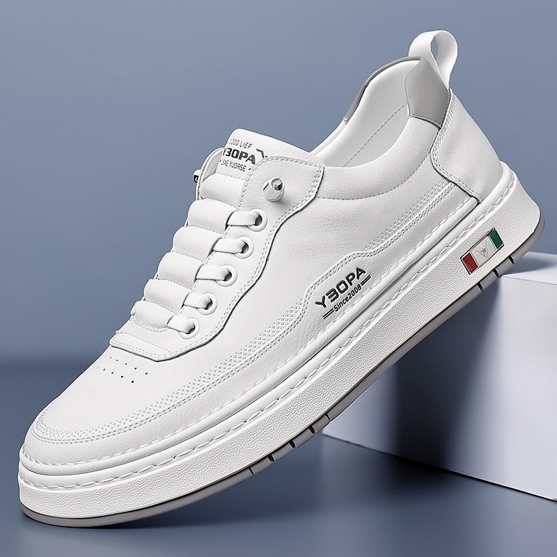 Low-top lace-up trainer with panelled upper, round toe and flat textured sole