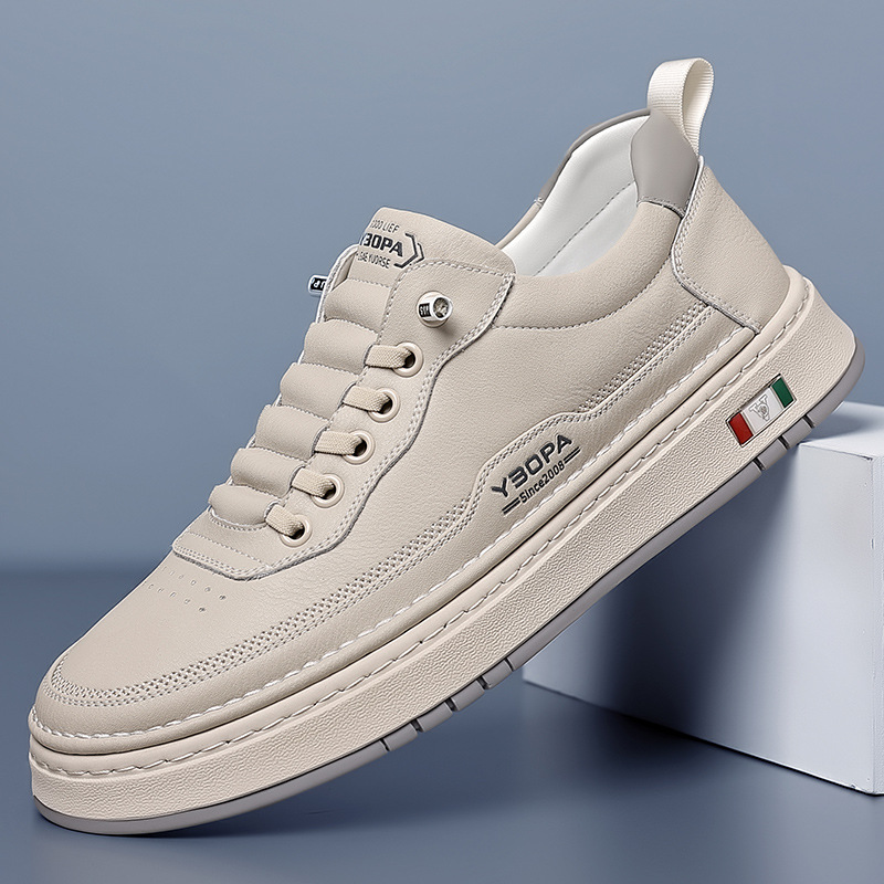 Low-top lace-up trainer with panelled upper, round toe and flat textured sole