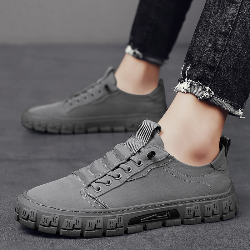 Low-top lace-up sneakers with panelled uppers and thick textured soles