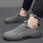 Low-top lace-up sneakers with panelled uppers and thick textured soles