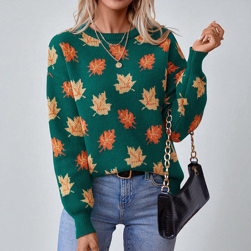 Women's crew neck sweater with an all-over leaf pattern and long sleeves