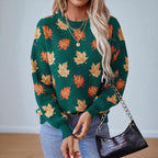 Women's crew neck sweater with an all-over leaf pattern and long sleeves