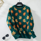 Women's crew neck sweater with an all-over leaf pattern and long sleeves