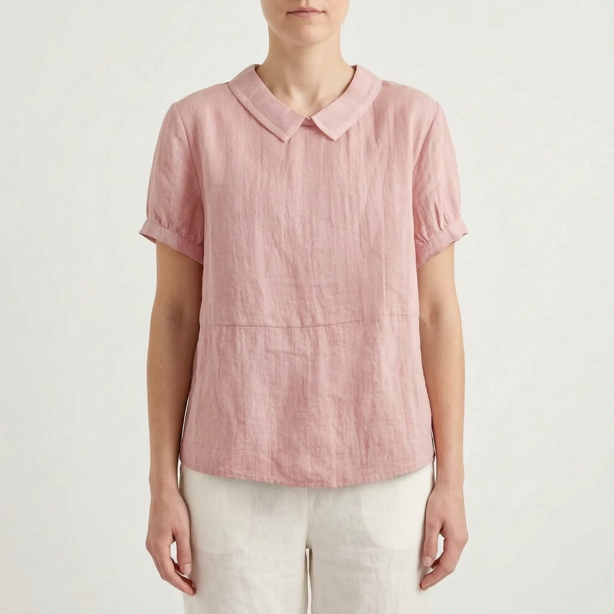 Women's light blue short-sleeved blouse with contrasting white rounded collar and curved hem