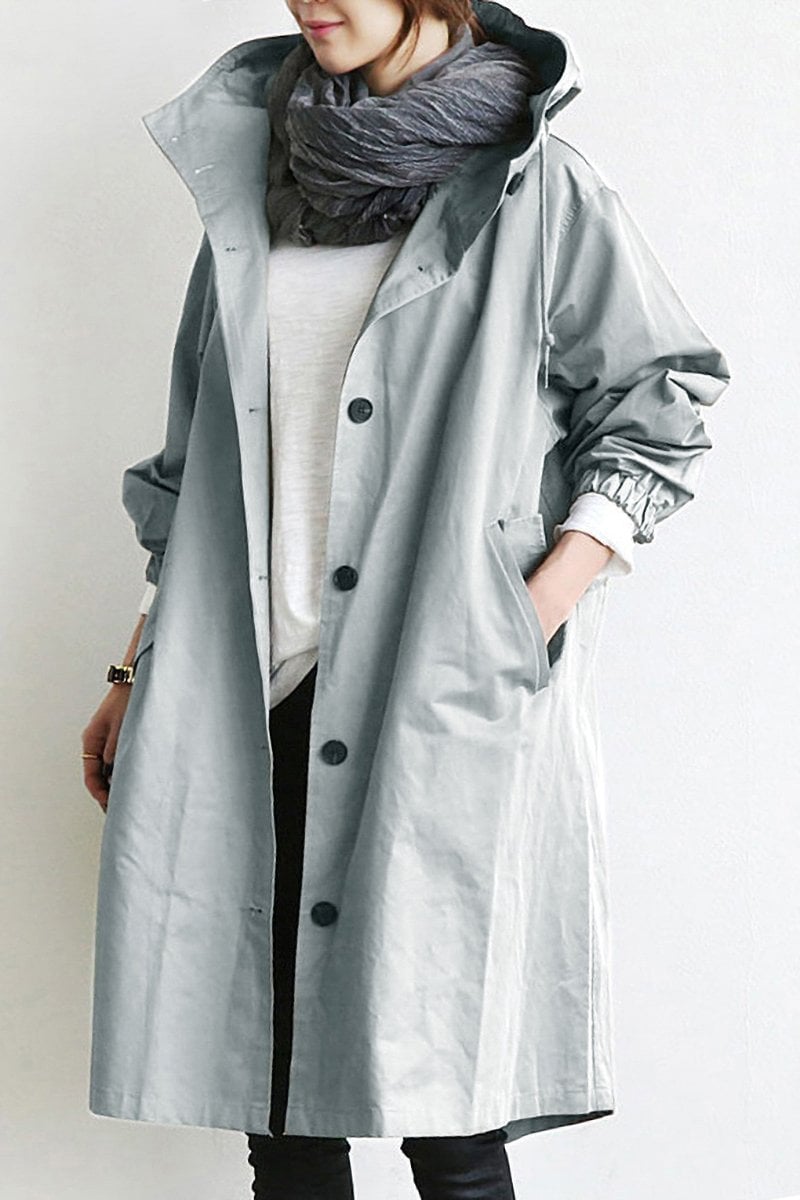 Women's longline hooded button-front trench coat with gathered cuffs and front pockets