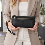Textured women's zip purse with wrist strap and contrast stitching